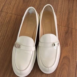 Christian Louboutin Patent leather loafers. White w/ silver buckles.